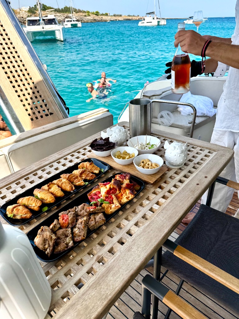 Aperitivo and food spread on board